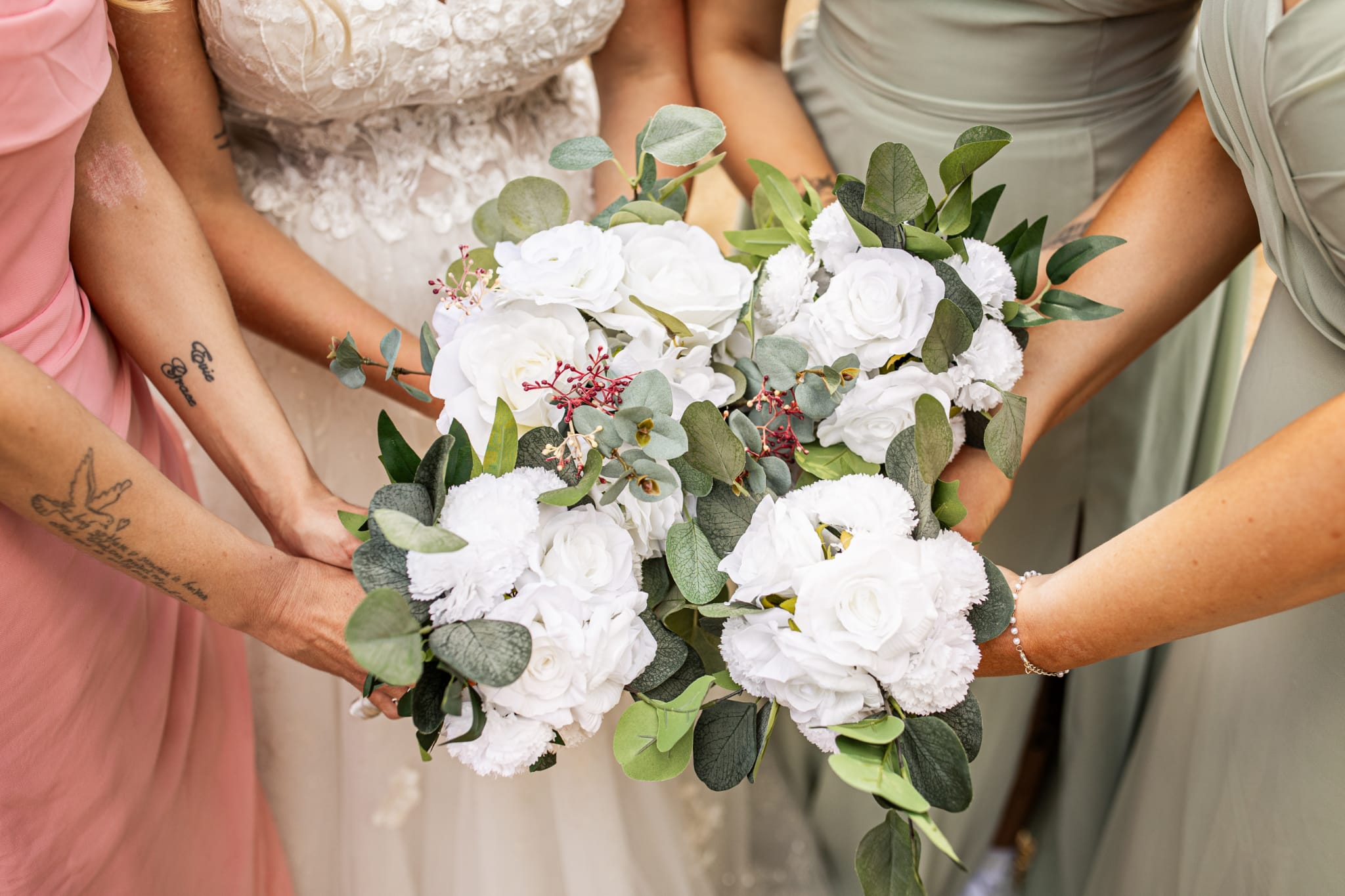 J and K bouquets Bride's bouquet and bridesmaids' bouquets in white and green