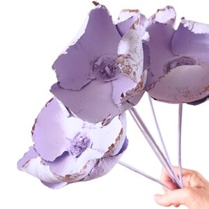 Pale lilac dried palm cup showing texture and wooden stems