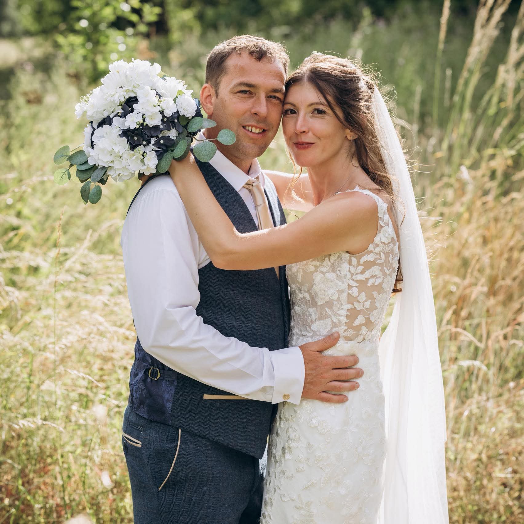Wedding couple in a summer field