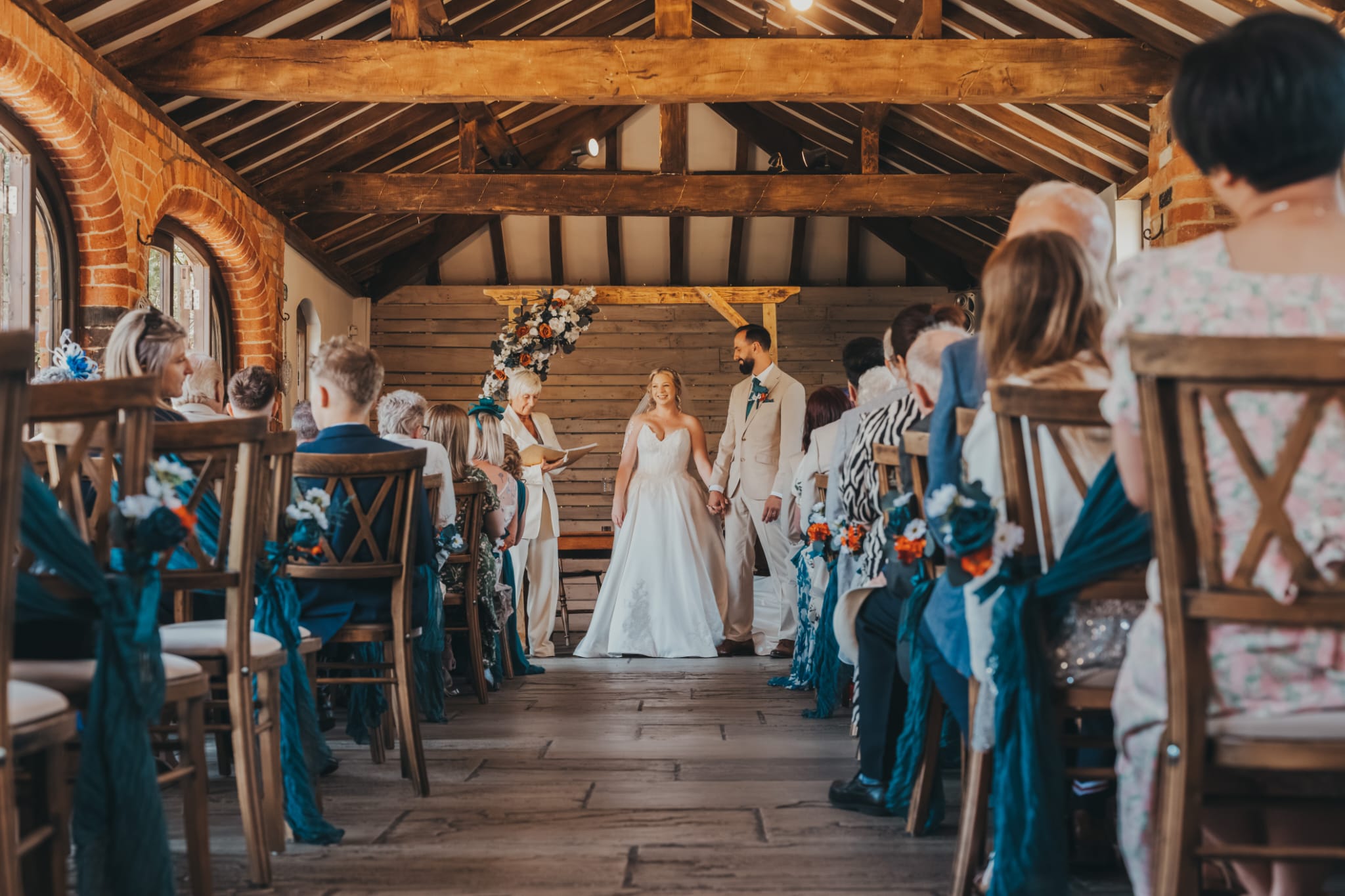 Wedding couple at their ceremony with celebrant